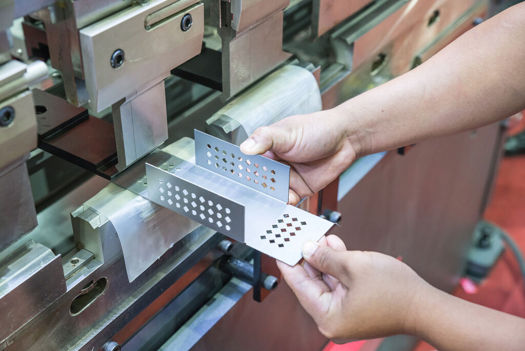 Worker at manufacture workshop operating cidan folding machine